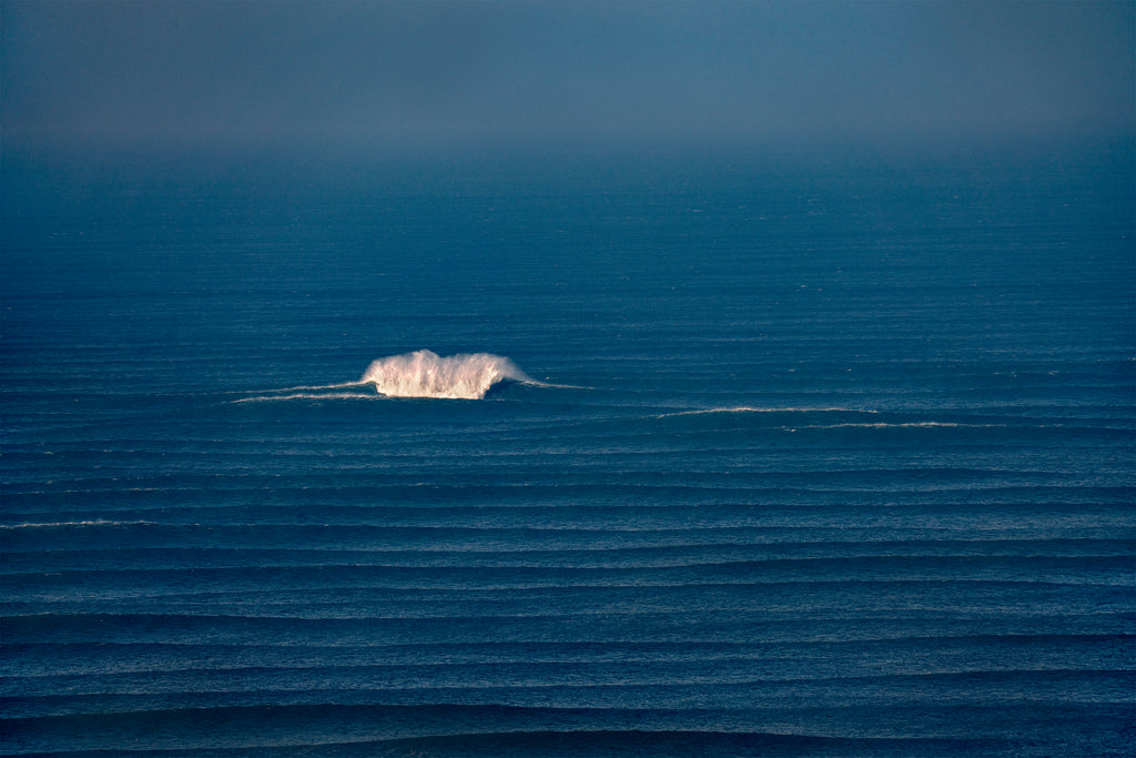 Luxury wall fine art photograph of a massive solitary wave breaking at the Potato Patch in San Francisco, captured by 10x Big Wave Award winner Fred Pompermayer.