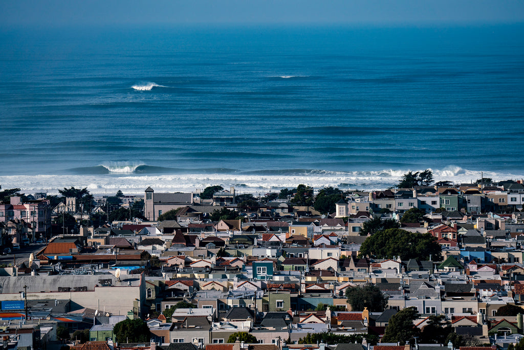  Luxury San Francisco wall fine art featuring the Sunset District residential skyline overshadowed by a massive large wave at Ocean Beach, limited edition photography by Fred Pompermayer.